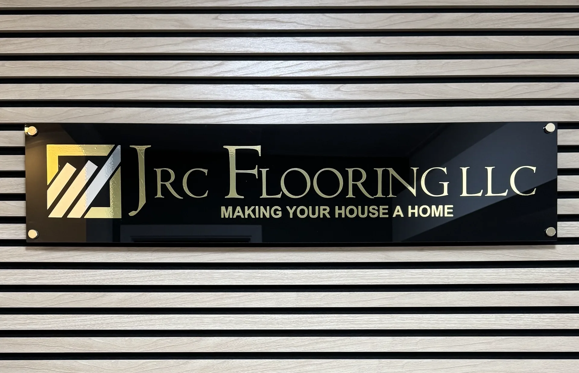 JRC Flooring exterior sign plaque.